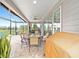 Spacious screened patio featuring dining and seating areas, ideal for outdoor gatherings at 5111 Nw 35Th Pl, Ocala, FL 34482