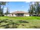 Expansive backyard with a well-maintained lawn and outdoor seating space, perfect for entertaining at 530 Nw 113Th Cir, Ocala, FL 34482