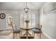Cozy dining area with stylish pendant lighting and views of the outdoors at 530 Nw 113Th Cir, Ocala, FL 34482