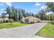 Charming single-story home with a spacious driveway and well-maintained lawn at 530 Nw 113Th Cir, Ocala, FL 34482