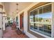 Inviting front porch with decorative lanterns and comfortable rocking chairs at 530 Nw 113Th Cir, Ocala, FL 34482