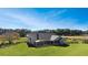Estate home with lush landscaping, and a screened-in porch at 5725 Ne 31St Ter, Ocala, FL 34479