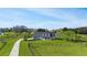 Estate home with mature trees, green lawns, and ranch fencing at 5725 Ne 31St Ter, Ocala, FL 34479
