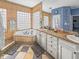 Bright bathroom with a soaking tub, granite counters, tiled floors, and dual sinks with vanity at 5725 Ne 31St Ter, Ocala, FL 34479