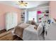 Charming bedroom with a bed, built-in shelving, and hardwood floors at 5725 Ne 31St Ter, Ocala, FL 34479