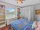 This bedroom features a window overlooking the backyard and built-in shelves for storage and display at 5725 Ne 31St Ter, Ocala, FL 34479