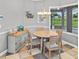 Breakfast nook with a round table, chairs, and a view to the outside at 5725 Ne 31St Ter, Ocala, FL 34479