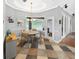 Charming breakfast nook featuring a round table, a pendant light fixture, and a view of the screened-in patio at 5725 Ne 31St Ter, Ocala, FL 34479