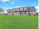 Beautiful house on a large lot, showcasing a well-maintained lawn and inviting front porch at 5725 Ne 31St Ter, Ocala, FL 34479