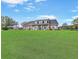Inviting home set on a verdant lawn, featuring a classic design and a welcoming front porch at 5725 Ne 31St Ter, Ocala, FL 34479