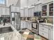 Updated kitchen with stainless steel appliances, beautiful cabinetry, and a unique tile floor for a modern look at 5725 Ne 31St Ter, Ocala, FL 34479