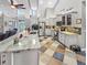 Open-concept kitchen with a large island, stainless steel appliances, and a unique tile floor at 5725 Ne 31St Ter, Ocala, FL 34479