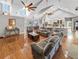 Spacious open-concept living room with soaring ceilings, hardwood floors, and stylish furnishings at 5725 Ne 31St Ter, Ocala, FL 34479