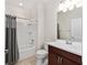 Bathroom showcasing tub and shower combination with stylish vanity and mirror at 5870 Sw 93Rd Cir, Ocala, FL 34481