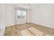 Bright bedroom with large window and modern ceiling fan at 5870 Sw 93Rd Cir, Ocala, FL 34481