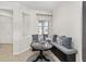Cozy breakfast nook with a built-in bench and decorative pillows next to a window at 5870 Sw 93Rd Cir, Ocala, FL 34481