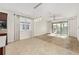 Bright dining area with a modern chandelier, sliding glass doors, and open-concept design at 5870 Sw 93Rd Cir, Ocala, FL 34481