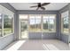 Inviting sunroom with plenty of natural light and beautiful outdoor views at 5870 Sw 93Rd Cir, Ocala, FL 34481