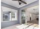 Bright sunroom leading to the interior with sliding glass doors and backyard views at 5870 Sw 93Rd Cir, Ocala, FL 34481