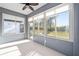 Relaxing sunroom filled with natural light and picturesque views of the property at 5870 Sw 93Rd Cir, Ocala, FL 34481