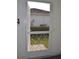 Backdoor view, showcasing the backyard, greenery, and the home's exterior, enhancing curb appeal at 6548 Sw 84Th Place Rd, Ocala, FL 34476