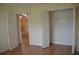 Spacious bedroom featuring an open closet and a doorway leading to another room at 6548 Sw 84Th Place Rd, Ocala, FL 34476
