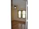 Cozy bedroom features hardwood floors, a ceiling fan, and a window that allows for natural light at 6548 Sw 84Th Place Rd, Ocala, FL 34476