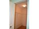 Well-lit walk-in closet with wood flooring and wire shelving at 6548 Sw 84Th Place Rd, Ocala, FL 34476