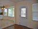 Dining area adjacent to the kitchen, featuring natural light, and view of an outdoor area at 6548 Sw 84Th Place Rd, Ocala, FL 34476