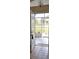 View from inside the front door of the tiled entry hall looking out to the screened in front porch at 6548 Sw 84Th Place Rd, Ocala, FL 34476