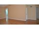 Bright living room with hardwood floors and an open floor plan, ready for personalization at 6548 Sw 84Th Place Rd, Ocala, FL 34476