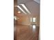 Spacious living room with hardwood floors, vaulted ceiling, and an abundance of natural light at 6548 Sw 84Th Place Rd, Ocala, FL 34476