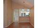 Open-concept living and dining area with hardwood floors and connection to the kitchen at 6548 Sw 84Th Place Rd, Ocala, FL 34476