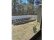 View of the backyard with a white privacy fence, offering a private outdoor space at 6884 Sw 149Th Lane Rd, Ocala, FL 34473