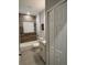 Updated bathroom featuring a wood plank accent wall, modern vanity, and shower-tub combo at 6884 Sw 149Th Lane Rd, Ocala, FL 34473