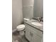 Bathroom featuring granite counters, white cabinets, and modern fixtures at 6884 Sw 149Th Lane Rd, Ocala, FL 34473