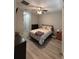 Cozy bedroom with laminate flooring, featuring ample closet space and natural light at 6884 Sw 149Th Lane Rd, Ocala, FL 34473