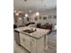 Open concept kitchen featuring a center island with stainless steel appliances and ample counter space at 6884 Sw 149Th Lane Rd, Ocala, FL 34473