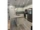 Well-appointed kitchen boasting stainless steel appliances, granite countertops, and a functional center island at 6884 Sw 149Th Lane Rd, Ocala, FL 34473