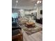 Comfortable living area featuring an open floor plan and seamless flow to the kitchen at 6884 Sw 149Th Lane Rd, Ocala, FL 34473