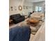 Bright living room with hardwood floors and an open floor plan offering versatile furniture arrangements at 6884 Sw 149Th Lane Rd, Ocala, FL 34473