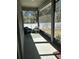 Cozy screened patio with comfortable seating, perfect for relaxation and enjoying the outdoors at 6884 Sw 149Th Lane Rd, Ocala, FL 34473