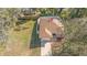 Overhead shot of a home featuring a driveway, green lawn, and white privacy fence at 811 Niles St, Daytona Beach, FL 32114