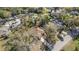 Overhead shot displays a home with surrounding trees and a long driveway in a residential neighborhood at 811 Niles St, Daytona Beach, FL 32114