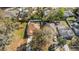 Birds eye view of a suburban home with fenced yard and mature trees at 811 Niles St, Daytona Beach, FL 32114
