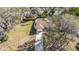 Aerial view of a charming single Gathering home with mature trees and a long driveway at 811 Niles St, Daytona Beach, FL 32114