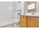 Bathroom featuring a walk-in shower, toilet, vanity, and storage at 811 Niles St, Daytona Beach, FL 32114
