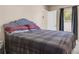 Comfortable bedroom featuring a bed, carpet flooring, and view of window and closet at 811 Niles St, Daytona Beach, FL 32114