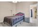 Cozy bedroom featuring a comfortable bed, neutral paint color and carpet flooring at 811 Niles St, Daytona Beach, FL 32114
