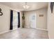 Cozy dining area with tile flooring, a hanging light fixture, and access to the backyard at 811 Niles St, Daytona Beach, FL 32114